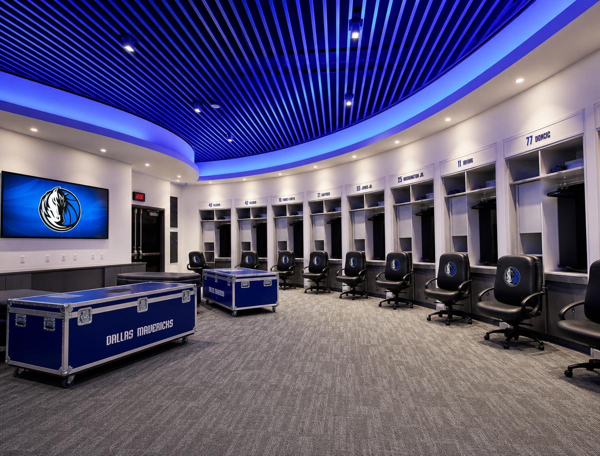 Dallas Mavericks locker room with curved white locker stalls, team-branded chairs, and blue LED ceiling lighting